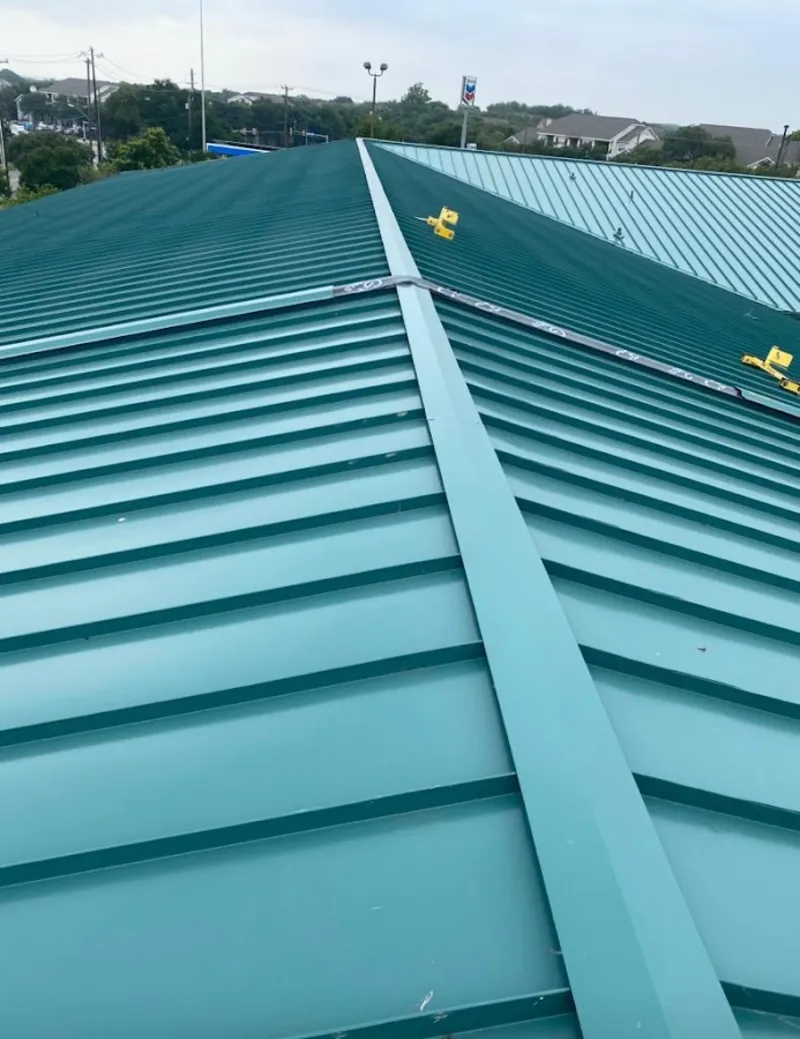 Green commercial metal roof ridge and valley for Metal Roof Repair in St. Stephens