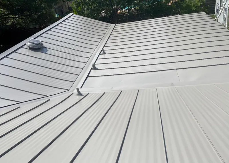 Solar attic fan installed on a metal roof for Roof Ventilation in St. Stephens
